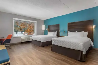 a hotel room with two beds and a window at Tru By Hilton Bracebridge, On in Bracebridge