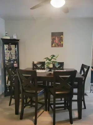 a dining room table and chairs with a plant on it at ARCA Cozy Cabin-Innisfil Beach in Innisfil