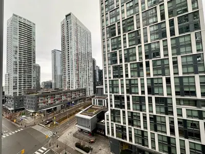 an aerial view of a city with tall buildings at Comfy 1Bdrm den 2Baths with 3 real beds plus parking in Toronto