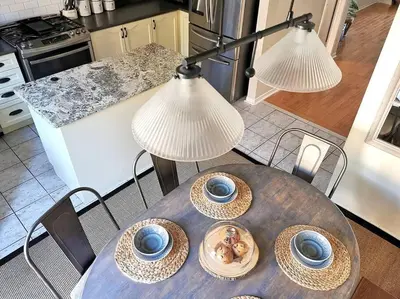 a table with two blue bowls on it in a kitchen at LakePark Artsy 3 bedroom Townhouse 1 Parking in Toronto