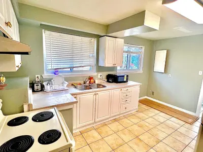 a kitchen with a sink and a stove at Private Room Near Airport D2 in Brampton