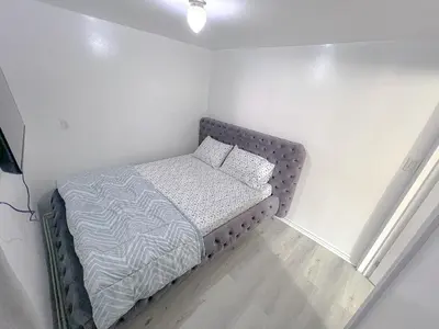 a small bedroom with a bed in the corner at Private Room Near Airport D4 in Brampton
