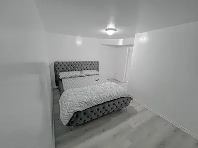 a small bedroom with a bed in a room at Private Room Near Airport D6 in Brampton