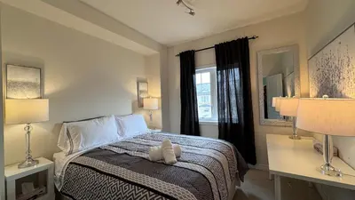 a bedroom with a bed with a stuffed animal on it at 9 Queen Beds, 18 Guests-Kleinburg Luxe Crown Town Residence in Vaughan