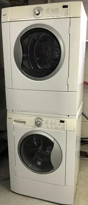 two washing machines stacked on top of each other at Super Cosy Peaceful room with Garden view free Parking in Toronto