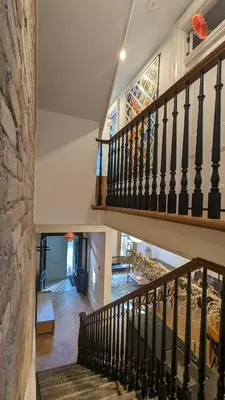 a staircase in a home with a stained glass window at Stunning Victorian in Downtown in Toronto