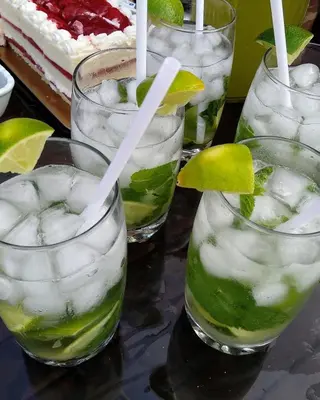 a group of glasses filled with ice and lime margaritas at Niagara Creekside B&B - Waterfront suite in Niagara Falls