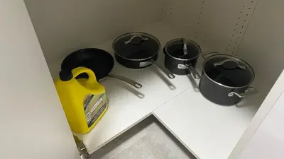 three pots and pans on a counter in a bathroom at Cozy Basement in Richmond Hill