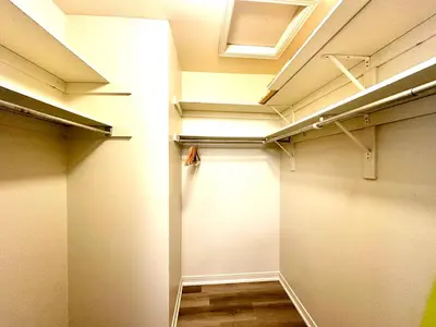 a walk in closet with white walls and lights at Cozy and spacious vacation home in Toronto in Toronto