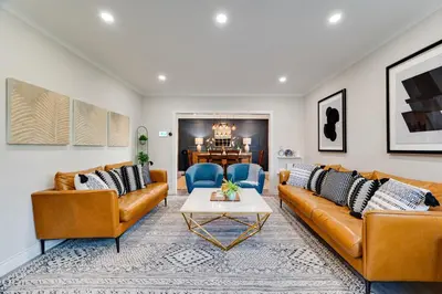 a living room with two couches and a table at Resort-like 4BR 3BA near Downtown, Four seasons Hot Tub, Gym, King Bed in Toronto
