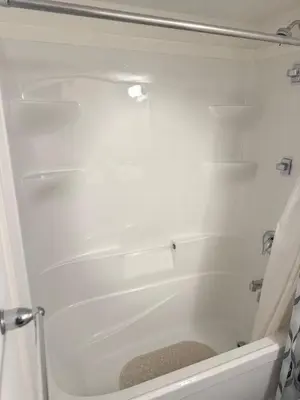 a white bath tub in a bathroom with a shower curtain at LuxSpace Properties in London