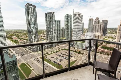 a balcony with a view of a city at Executive 2BR 2BATH Condo with Lakeview Steps from SQ1 in Mississauga