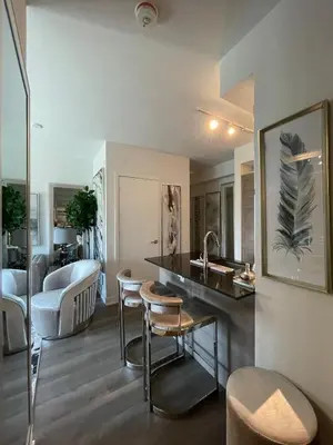a kitchen with a sink and a living room at Toronto Bloor & Yonge Luxury Condo in Toronto