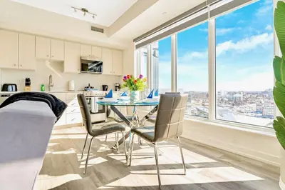 a kitchen and dining room with a table and chairs at High Rise 1BR Building w Gorgeous Views in Kitchener