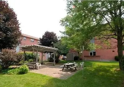 a picnic table in the yard of a building at 56 Hiawatha in Woodstock