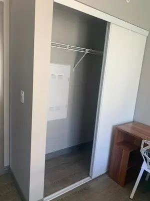 a walk in closet with a glass door at Sandy&Kevin#home in Waterloo