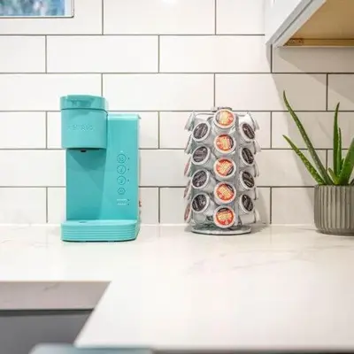 two vases sitting on a kitchen counter with a blue appliance at Beautiful Apartment 5 mins from Innisfil Beach in Innisfil