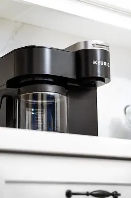 a coffee pot sitting on top of a toaster oven at 3bed 2bath heritage duplex - Prime Location in Collingwood