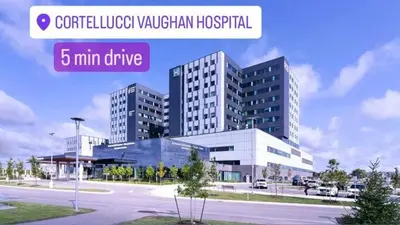 a rendering of a large building in a city at Cozy Walkout Suite in Vaughan