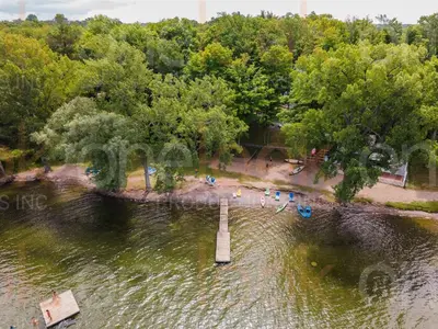 an aerial view of a body of water with a pier at The Chickadee - 21 Farm View in Cherry Valley