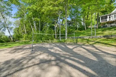 a net on a dirt road in front of a house at The Jack Pine - 50 Hollow in Cherry Valley