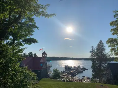 a view of a dock with boats in the water at McCracken's Mid Century Modern Luxury Cottage in Burleigh Falls
