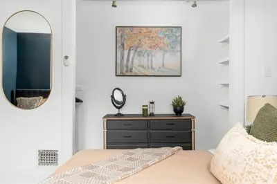 a bedroom with a mirror and a dresser at 1BR Apartment Near Queen West in Toronto