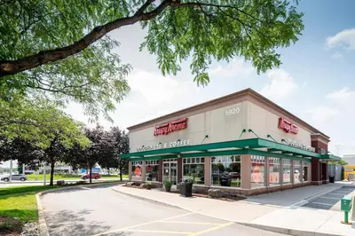 a store with a green awning on a street at Affordable Private Suite, Near Airport, Free Parking in Mississauga