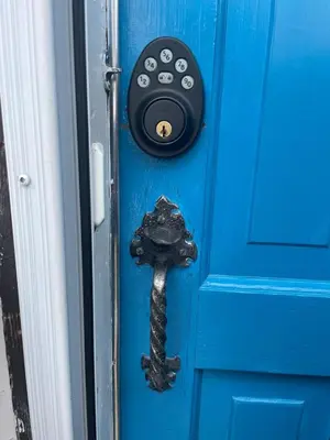 a blue door with a black door knob at Sunrise and Bayview with SNOW SHOES, WATERCRAFTS , BIKES in Meaford