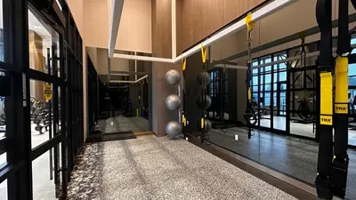 a hallway of a building with a gym at Stunning new condo in Oakville in Oakville
