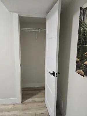 a room with a closet with a white door at 1 Bedroom Apartment with Living Room and Full Washroom to yourself alone and a private car park in London