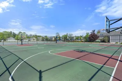 a tennis court with two tennis courts at The Phoebe - 65 Butternut in Cherry Valley