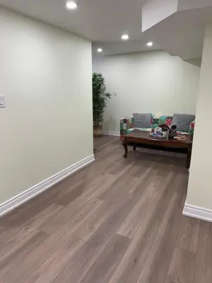 a living room with a couch and a table at B1 Beautiful and cozy private suite in Mississauga