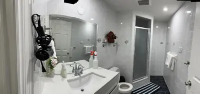 a white bathroom with a sink and a toilet at B01 cozy private room with bathroom in Mississauga