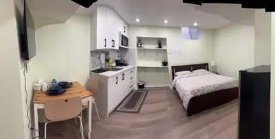 a small bedroom with a bed and a table at B3 Luxury home in Mississauga nearby shipping center square one in Mississauga