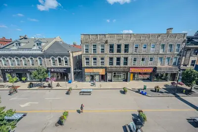 an empty street in a city with buildings at Charming 2 Bed Apartment in Cambridge