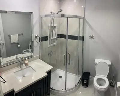 a bathroom with a shower and a toilet and a sink at F2 Comfy Private Room in city square one in Mississauga