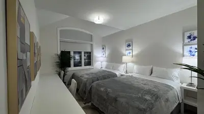 a hotel room with two beds and a window at Exquisite Luxury Townhomes in Elite Angus Glen Estate in Markham