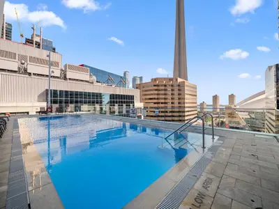 a large swimming pool on top of a building at Belarte Suites - Downtown Toronto - CN Tower & Rogers Centre in Toronto