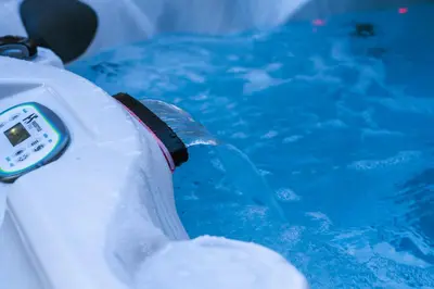 a bottle of water in a swimming pool at White Rose Chalet at Blue Mountains for 20 w Hot Tub in Blue Mountains