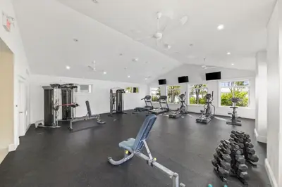 a gym with several treadmills and cardio machines at The Cattail - 26 Meadowview in Cherry Valley