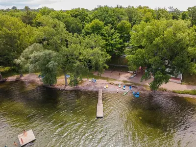 an aerial view of a body of water with a pier at 40 Meadow View in Cherry Valley