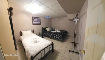 a small room with a bed and a couch at 70 percent Off Luxurious Hot Tub,Sauna, 2000Sqft of Private in Vaughan