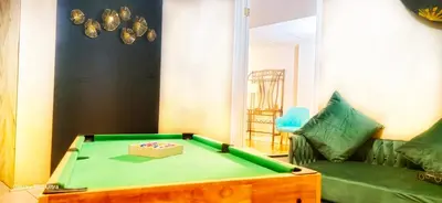 a living room with a pool table and a couch at 70 percent Off Luxurious Hot Tub,Sauna, 2000Sqft of Private in Vaughan