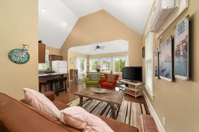 a living room with a couch and a table at The Chicory - 4 Meadow View in Cherry Valley