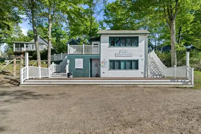 a house with a staircase leading up to a playground at The Duskywing - 44 Meadow View in Cherry Valley