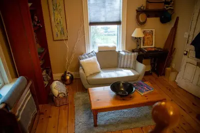 a living room with a couch and a coffee table at The Artists' House Getaway in Collingwood