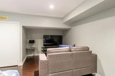 a living room with a couch and a table at Chic 3BR apartment in Queen West, Downtown Toronto in Toronto