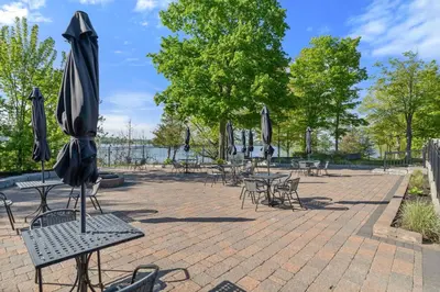 a group of tables and chairs with umbrellas at The Kestrel - 2 Butternut in Cherry Valley