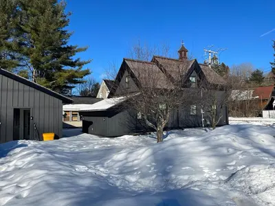 a house is covered in snow with a yard at Century Home in Bracebridge Muskoka in Bracebridge